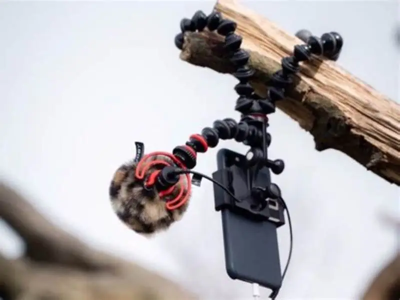 iPhone 15 Pro Max mounted upright on squat rack using a flexible Gorillapod